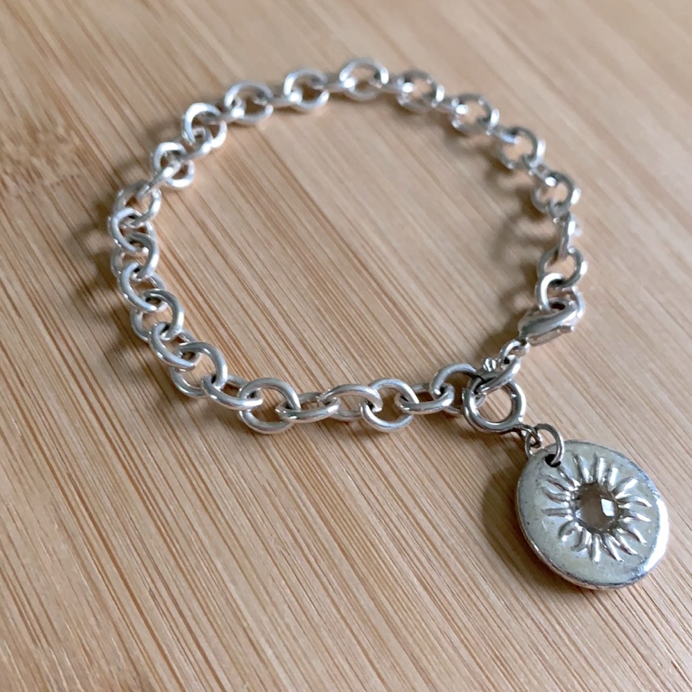 Silver toned Woman’s Bracelet with Sun Crystal Charm